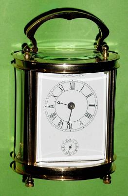 C.2002, China, New Old stock, oval carriage timepiece, small size, in faded gift box. — Antique Clocks Price Guide