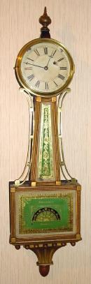 C.1850, Mass Banjo, 8-day, gold front, weight driven, 8-day. — Antique Clocks Price Guide