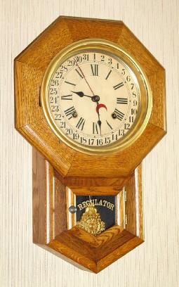 C.1920, Waterbury Clock Co., FULTON, 8-day time and calendar school clock in an oak case. — Antique Clocks Price Guide