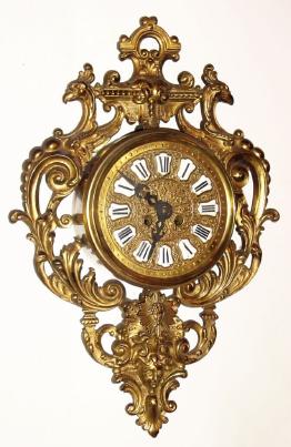 C.1900, French, Cast brass Cartel clock, with 8-day time and strike movement and exposed pivoted sunburst pendulum. — Antique Clocks Price Guide