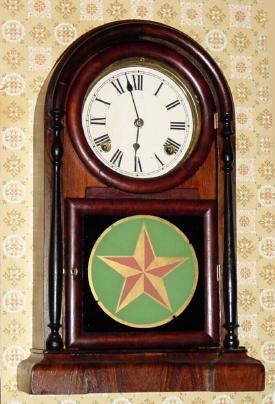 C.1878, E. N. Welch Mfg Co., Rosewood Shelf clock, with turned side columns, an Italian model with replaced door from another model (previous door latch is evidence). — Antique Clocks Price Guide