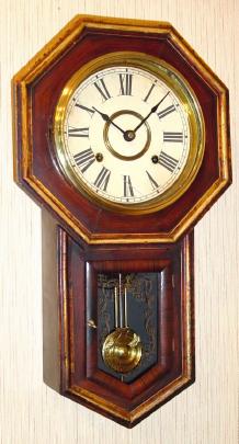 C.1905, Japan, Mini 8-day School Clock, in a faux grained drop octagon case. — Antique Clocks Price Guide