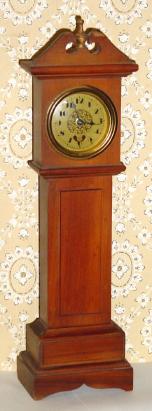 C.1920, Kronheimer Co., New York, mini tall case with "heartbeat" dial. — Antique Clocks Price Guide