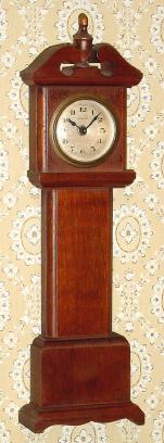 C.1920, German, "Florn" brand, 30 hour mini tall case made of solid wood segments, glued together. — Antique Clocks Price Guide