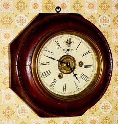 C.1875, Mixed lot, a Waterbury octagonal sectioned case, now with a New Haven time and alarm movement, mounted up on a spacer board within the case. — Antique Clocks Price Guide