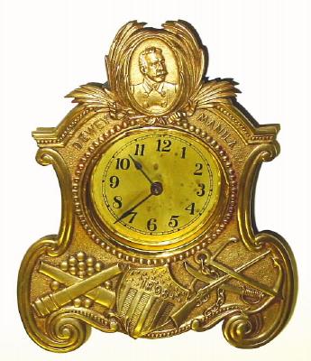 C.1900, American, P. I. and B. Co (cast into brass plated iron facade), 30 hour novelty commemorating Admiral Dewey's victory at Manila in 1898. — Antique Clocks Price Guide