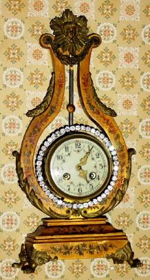 C.1900, French, Farcot, Lyre Form mantel clock, the case of wood, finished in gold with floral decorations in the style of Vernis Martin (front, sides and rear) and with ormolu mounts. — Antique Clocks Price Guide