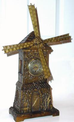 C.1885, French Windmill Automaton, an 8-day platform time movement and a separate spring motor above that powers the veins of the fan. — Antique Clocks Price Guide