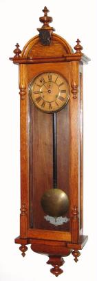 C.1900, Ansonia Clock Co., CAPITOL, oak cased, double spring, time only wall clock, 8-day. — Antique Clocks Price Guide
