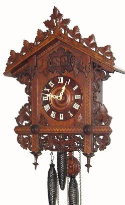 C.1900, Black Forest Cuckoo and Quail quarter strike wall clock with inlay and carved rail of leaves along the top. — Antique Clocks Price Guide