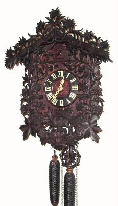 C.1890, Black Forest Cuckoo clock, one day, intricately carved case with edelweiss flowers. — Antique Clocks Price Guide