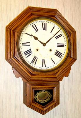 C.1915, Ansonia Clock Co, Short Drop Octagon, in oak, with 8- day time and strike movement. — Antique Clocks Price Guide