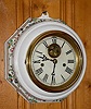 C.1890, Seth Thomas, ONE DAY LEVER, time and strike, in a fired porcelain case, with fired in floral decorations.