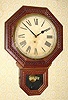 C.1915, E. Ingraham and Co.,12 INCH DROP OCTAGON, in a pressed oak case, 8-day time only.