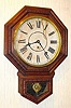 C.1910, Waterbury Clock Co., 12 INCH DROP, pressed oak octagon top school clock, 8-day time only.