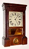 C.1863, Seth Thomas "O.G. Cornice", 8-Day mantel clock in rosewood with original orange peel finish and some minor veneer chips.
