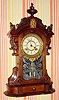 C.1880, Ansonia MONARCH, 8-Day ornate walnut cased shelf clock.