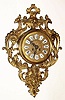 C.1900, French, Cast brass Cartel clock, with 8-day time and strike movement and exposed pivoted sunburst pendulum.