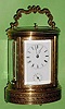 C.1880, French, Oval Brass Cased Carriage clock, with profuse geometric engraving, Grand Sonnerie, with repeat and alarm.