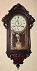 C.1875, E. N. Welch HANGING ITALIAN, 8-day time and strike, rosewood with carved accents.