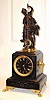C.1885, French, Guilmet, Mystery clock, a patinated spelter statue holding the pendulum which swings with no apparent impulse.