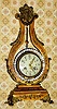 C.1900, French, Farcot, Lyre Form mantel clock, the case of wood, finished in gold with floral decorations in the style of Vernis Martin (front, sides and rear) and with ormolu mounts.