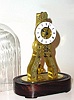 C.1851, French Skeleton Timepiece, with engraved front plate, on a wooden base, silk thread suspension.