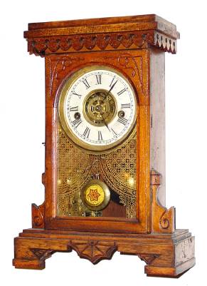 C.1900, Waterbury, VICTOR, Mini Kitchen clock, incised fruit wood, 30 hour time with strike and outboard alarm. — Antique Clocks Price Guide