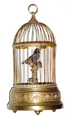 C.1920, Swiss or German, Singing Bird in Cage, the bird decorated with real feathers, and animated as he sings. — Antique Clocks Price Guide