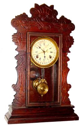 C.1900, Waterbury, Walnut GIBSON model calendar kitchen clock, 8-day time and strike. — Antique Clocks Price Guide