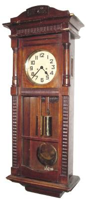 C.1928, German, 2-weight Box Regulator, in a walnut ripple molded case with some old wood worm damage in the cornice moldings. — Antique Clocks Price Guide