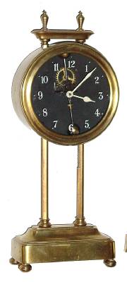 C.1921 English Gravity timepiece, the movement being driven by its own weight, to be raised each day along a ratcheted upright and with exposed escapement and compound bar-bell pendulum. — Antique Clocks Price Guide