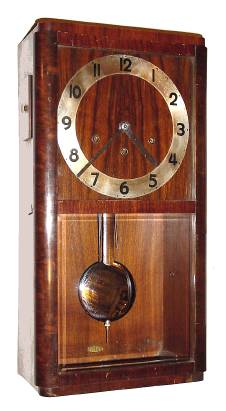C.1950, German for the French Market, 8-day time Westminster chime, plus strike, wall clock in a dark walnut art Deco case. — Antique Clocks Price Guide