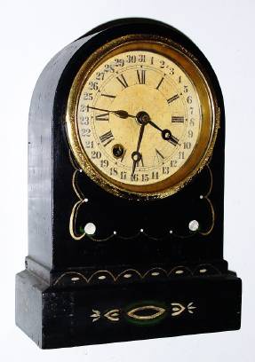 C.1870, Terry Clock Co, Waterbury, Conn, 8-day time and calendar, repainted black iron case. — Antique Clocks Price Guide