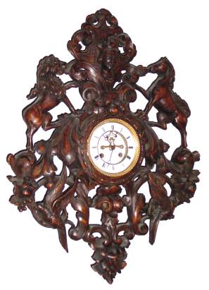 C.1890, French, (S. Marti) Carved Royal Crest Clock, 8-Day, open brocot escapement on porcelain dial, the walnut case with a lion to the left horse to the right, birds and fruit below. — Antique Clocks Price Guide