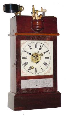 C.1870, Ansonia Brass and Copper Co., ILLUMINATED ALARM CLOCK, time and alarm in a refinished mahogany case. — Antique Clocks Price Guide