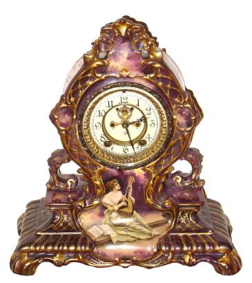 C.1904, Ansonia Clock Co., Royal Bonn, "LA CERDA", porcelain china clock with hand painted portrait of Mandolin player, open escapement, 8-day striking. — Antique Clocks Price Guide