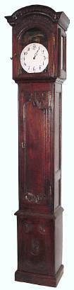 C.1800, French, Provincial Tall Case clock, 30-hour single weight time and strike (continuous chain Lantern movement), in a bog oak case with carved floral decorations. — Antique Clocks Price Guide