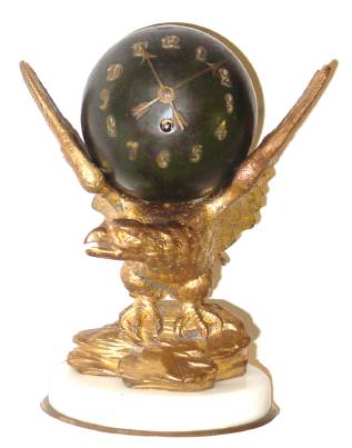C.1880, French, Patinated Spelter Mantel clock, 8-day timepiece, with an eagle holding a globe between its out-stretched wings. — Antique Clocks Price Guide
