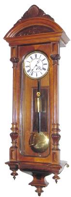 C.1880, Austrian, 1-Weight Vienna Regulator, in an Alt Deutsch walnut case with Corinthian columns right and left and original carved top. — Antique Clocks Price Guide