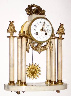 C.1890, French, S. Marti, Marble and Ormolu portico clock with sunburst pendulum and porcelain dial. — Antique Clocks Price Guide
