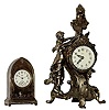 Lot of 2 novelty clocks: 1) Waterbury for Benedict Mfg, small cast metal desk clock,