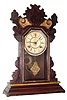 C.1890, Waterbury Clock Co., 8-day time/strike walnut gingerbread clock, as-found