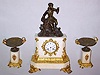 C.1900, French, Bronze and White Marble Figural clock set of who appears to be Christopher Columbus, with an 8-day bell strike round movement with porcelain dial and moon hands.