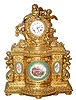 C.1850, French, Lenoir, Ormolu Figural Clock with 6 Figures and 3 Sevres type plaques, all gilt with prolific scrolls and swags, 8-day time and bell strike, silk thread suspension.