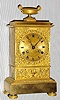C.1825, French, Empire Mantle Clock, Small, the front with scrolls and floral decorations, the cast bezel of rose buds, 8-day time and bell strike with silk thread pendulum