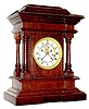 C.1889, E. N. Welch Mfg Co., "Norma" 8-day time and strike mantel clock in mahogany, French sash with beveled glass.