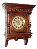C.1890, Austrian or South German, Large Walnut wall clock, enclosed pendulum, with fancy gilt/silver dial and tulip hands.