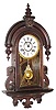 C.1917, New Haven Clock Co., CUBA, Hanging gingerbread in dark mahogany finish, 8-day time and strike.