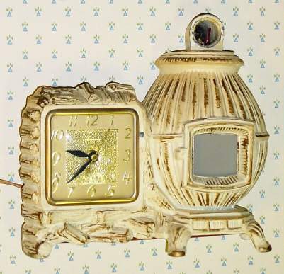 C.1940, United Clock Corp, Brooklyn, NY, MODEL 465 ,Pot Belly Stove 110v , electric timepiece, light and animation. — Antique Clocks Price Guide